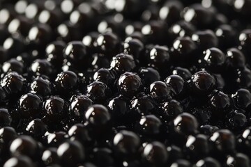A close-up of black tapioca pearls, commonly known as boba, ready for use in a delicious bubble tea. The pearls are shiny and smooth, symbolizing sweetness, texture, and enjoyment.