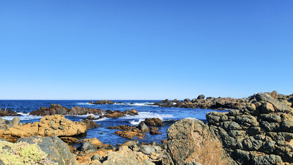 WAVES HITTING ON THE ROCKS. PACIFIC OCEAN COAST IN CHILE.