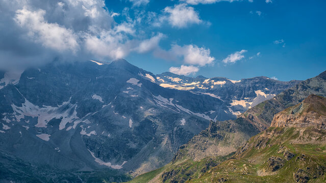 View of the mountain around Col de Nivolet, an alpine pass between the Orco Valley (Piedmont) and Valsavarenche (Aosta Valley), in the Gran Paradiso National Park, near the Italian-French border.