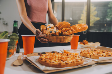 Group of young friends eating pizza.Home party.
