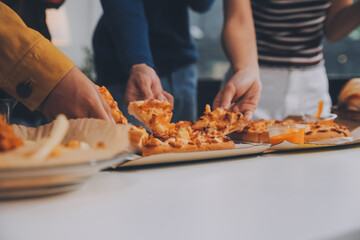 Group of young friends eating pizza.Home party.