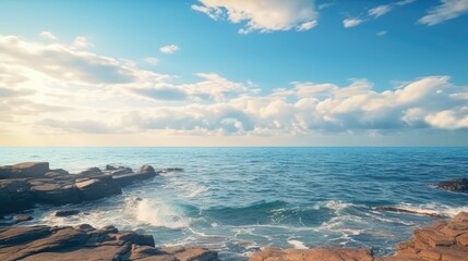 Obraz premium A serene coastal scene with sand, ocean, and a beautiful sky.
