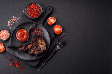 Juicy grilled beef tomahawk steak with salt, spices and herbs