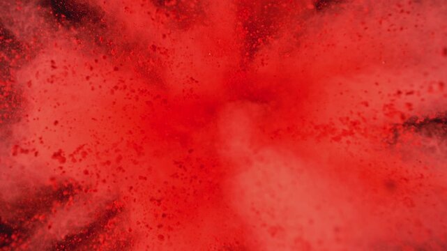 Super Slow Motion of Red Powder Explosion, Isolated on Black Background. Filmed on High Speed Cinema Camera, 1000fps.