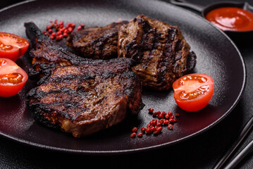 Juicy grilled beef tomahawk steak with salt, spices and herbs
