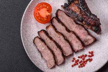 Juicy grilled beef tomahawk steak with salt, spices and herbs