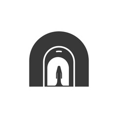 Fototapeta premium Silhouette of a Person in a Long Robe Standing in a Tunnel Entrance