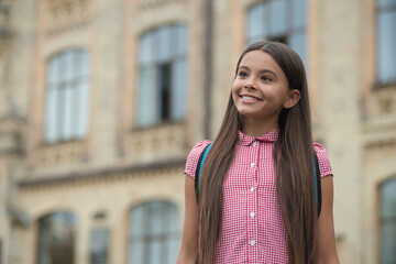 Fototapeta premium Education and knowledge. Girl pupil with bag at secondary school outdoor. Study time. September 1. College education. Back to school. Teen girl with backpack going to school. Formal schooling