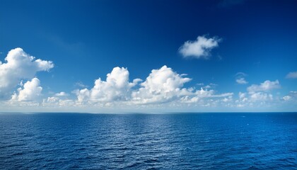 Obraz premium Blue Sky with White Clouds Over the Ocean