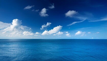 Obraz premium Blue Sky with White Clouds Over the Ocean