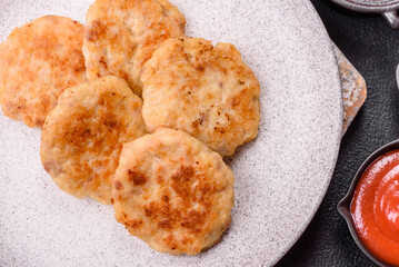 Delicious fresh fried minced fish cutlets with spices and herbs