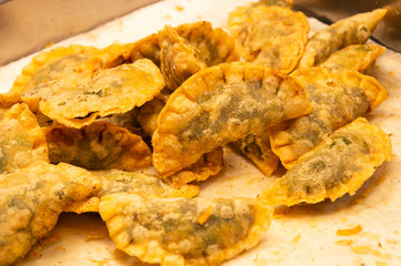 Chive dessert is a type of flour dessert of the Teochew people. The dough is made from rice flour mixed with tapioca starch. The filling is made from green chives.