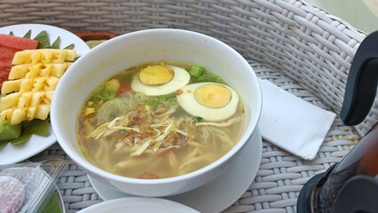 Asian Noodle Soup and Tropical Fruits on Floating Tray