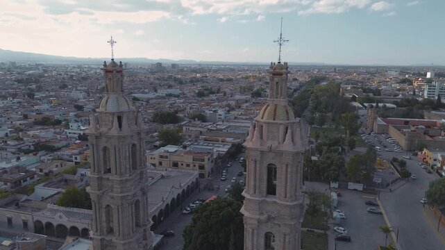 San luis potosi Aerial view of the church Parroquia Basilica Santuario de Nuestra Se&ntilde;ora de Guadalupe during sunset with the city in the background, beautiful religious catholic architecture