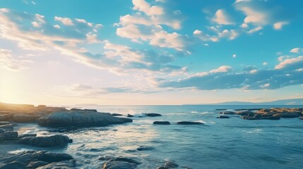 Obraz premium A serene coastal scene with sand, ocean, and a beautiful sky.