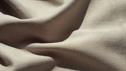 Beige cotton fabric. Texture of cotton fabric. Satin. Textile background.