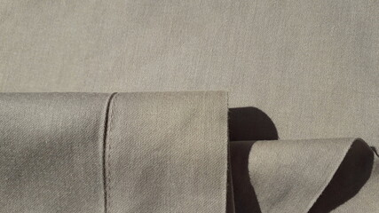Beige cotton fabric. Texture of cotton fabric. Satin. Textile background.