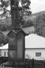 old tombstone with a cross next to the Orthodox church of St. Michael the Archangel in Turzańsk in...