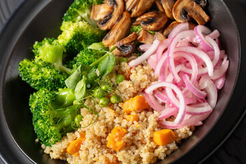 quinoa with veggies and mushrooms in a bowl