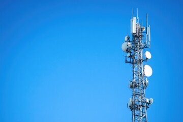 Satellite Dish Equipped Internet Tower Against Clear Sky