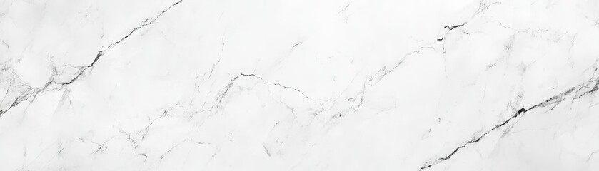 Fototapeta premium Elegant white marble texture with subtle gray veining, perfect for backgrounds, design projects, and architectural elements.