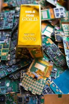 pile of electronic waste on factory floor is circuit board of mobile phone waiting to be processed extract gold to separate precious metal from electronic waste. extracting precious metal from e-waste