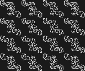 White floral pattern in doodle style on black background