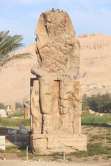 Famous Colossi of Memnon. Massive ruined statues colossi of the Pharaoh Amenhotep III. Travel and...