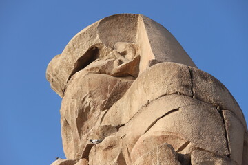 Famous Colossi of Memnon. Massive ruined statues colossi of the Pharaoh Amenhotep III. Travel and...