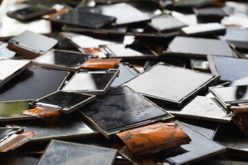 damaged LCD screens of mobile phones are collected as electronic waste waiting for valuable metals inside LCD screens be sorted for reuse reducing e-waste in nature and increasing value of e-waste.