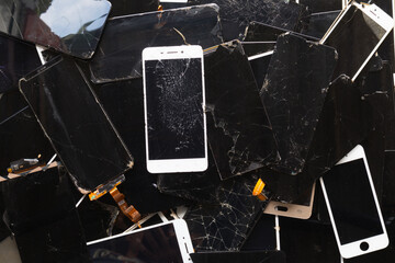 damaged LCD screens of mobile phones are collected as electronic waste waiting for valuable metals...