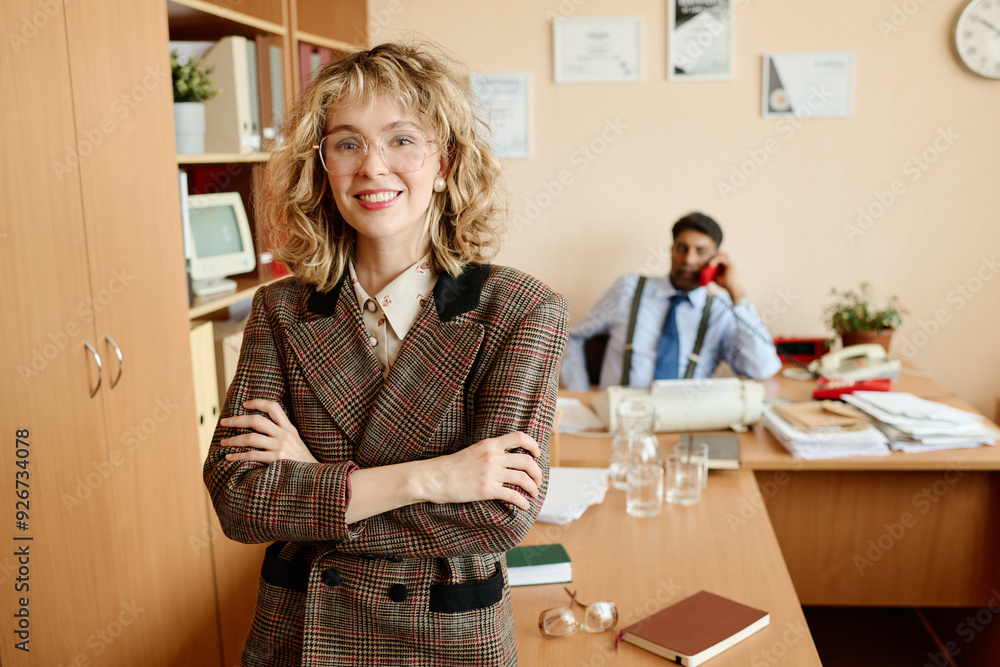 Aufkleber portrait of smiling professional woman standing with arms crossed in office environment with coworke
