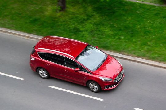 Red Ford S-Max Mk2 MPV family car with motion blur effect