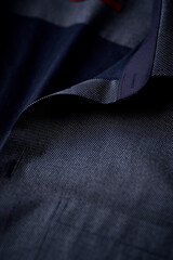 Close up of dark Men's shirt. Soft focus. Copy space.