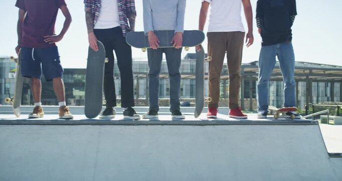 Sports, legs and a group of skater friends on a halfpipe outdoor at the skatepark for training together during summer. Feet, skateboard and a people in a line on a ramp for leisure or recreation