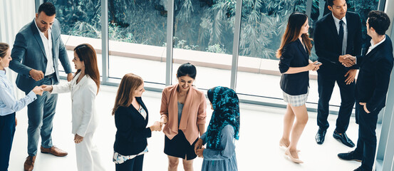 Many business people gathering in modern office building for business conference in the city....