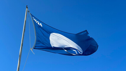 Zoom photo of 2024 blue flag representing cleanliness of the seas certifying marine quality...