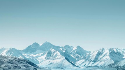 Obraz premium Snowy mountain range under a clear blue sky