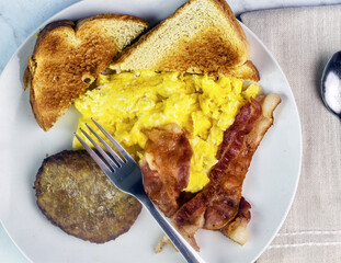 scramble eggs  with bacon and sausage patty
