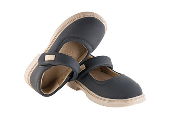 Cute child's black shoes, isolated on a white background. Full depth of field.