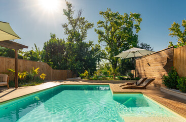 Elegant Villa Pool with Lounge Chairs and Palm Trees. Concept of serene luxury and relaxation in a...