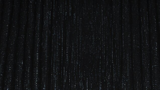 Abstract, dark digital rain made of binary code flowing down screen.