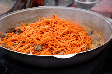 Vibrant and Freshly Cooked Carrots are Beautifully Placed on Top of a Savory and Delicious Meat Dish Served Warm