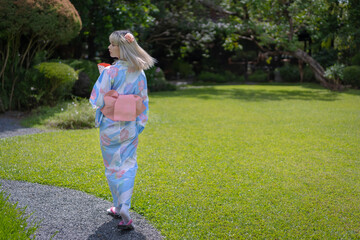 Pretty girl in a Yukata dress.  A young Asian woman wearing a traditional Japanese kimono or Yukata...
