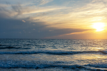 Summer background with tropical beach during sunset.