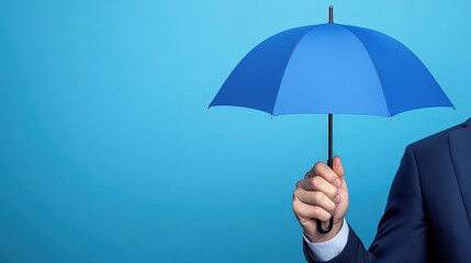 Person Holding Blue Umbrella Against Light Background