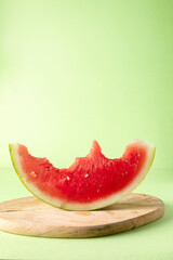 Half-moon cut watermelon with bite