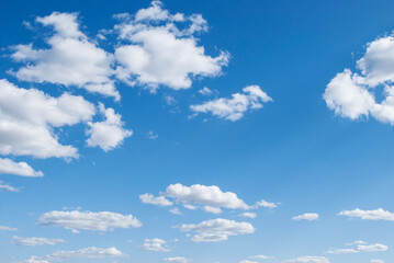 gentle white clouds in the blue sky