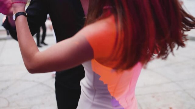 High school graduates dancing on prom, waltz and classical ball dance in dresses and suits on school graduation party, girls and boys classical ballroom dancers, couples dance quadrille and polonaise