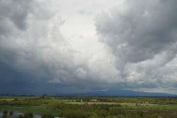 storm cloudsstorm clouds of various shades in blue sky at noon. of various shades in blue sky at noon. horizontal